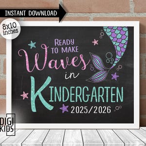 May include: A rectangular sign with a black chalkboard background featuring the text READY TO MAKE Waves in KINDERGARTEN 2025/2026. The design includes a glittery mermaid tail, small starfish, and bubbles in shades of pink, purple, and teal.