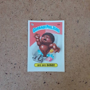 Vintage Garbage Pail Kids "Bye Bye Bobby" trading card sticker, collectible Topps #59b from 1986- generation x gross-out humor!