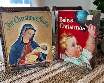 May include: Two vintage Little Golden Books, "The Christmas Story" and "Baby's Christmas". The books are red, blue, and yellow with illustrations of the nativity scene and a baby reaching for a Christmas ornament.