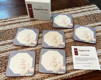 May include: Set of six blue and white floral coasters with a satin finish. The coasters are packaged in a white box with the text "English Life" and "Six Coasters".