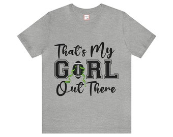 May include: A heather gray t-shirt with black text that reads "That's My Girl Out There" with a football graphic in the middle of the word "Girl".