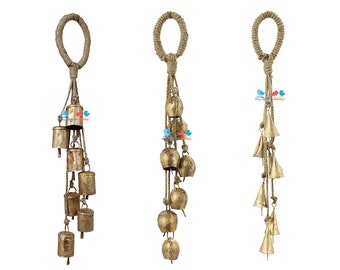 May include: Three gold-colored metal wind chimes with a jute rope hanger and multiple bells. Each chime has a different style of bell.