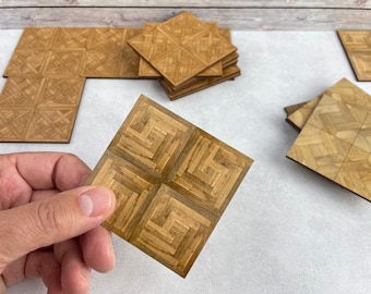 May include: A set of brown wood parquet floor tiles with a geometric pattern. The tiles are arranged in a square shape and are ready to be installed.