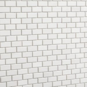 May include: White brick wall with a slightly off-center perspective. The bricks are arranged in a traditional brick pattern.