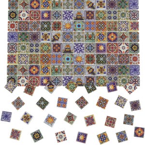 May include: A collection of colorful square ceramic tiles with intricate patterns. The tiles feature a variety of designs, including floral motifs, suns, and geometric shapes, in shades of blue, yellow, red, and green. Some tiles are scattered below the main group.