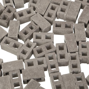 Miniatuur sintelblokken: grijze ambachtelijke stenen voor schoolprojecten