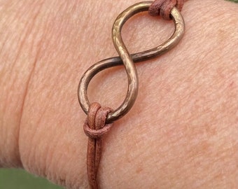 Infinity copper bracelet antique copper hammered copper brown leather cord sliding knot unisex woman man girlfriend boyfriend friendship