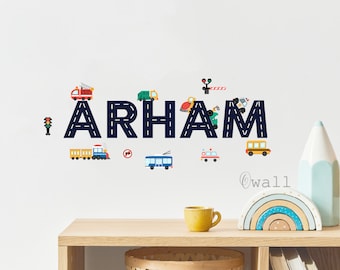 May include: A blue and white road-themed name decal with the name "ARHAM" in large letters. The letters are decorated with various colorful vehicles, including a fire truck, a garbage truck, a train, a bus, and a police car.