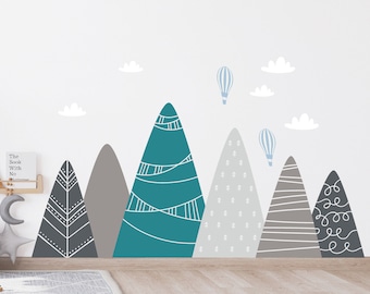 May include: A set of teal, gray, and white mountain wall decals with white clouds and blue hot air balloons. The decals are perfect for a nursery or child's room.