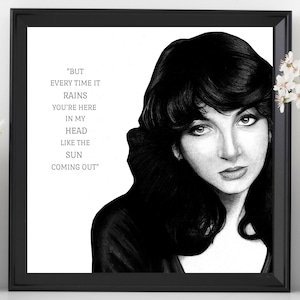 May include: Black and white drawing of a woman with long dark hair. The drawing is framed and includes the lyrics "BUT EVERY TIME IT RAINS YOU'RE HERE IN MY HEAD LIKE THE SUN COMING OUT"