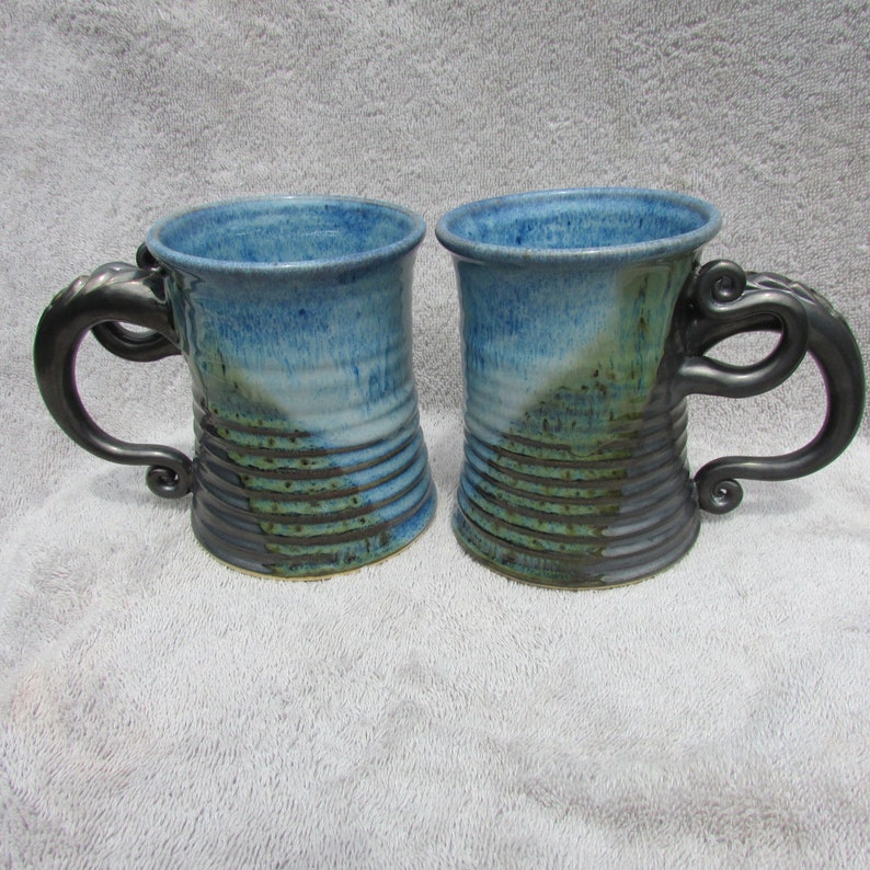 Unique double handle pottery mug with sculptural attachments Etsy