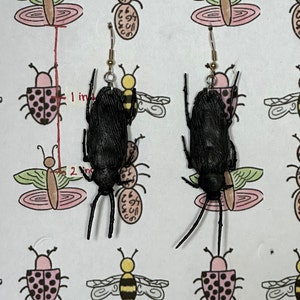 Black cockroach earrings
