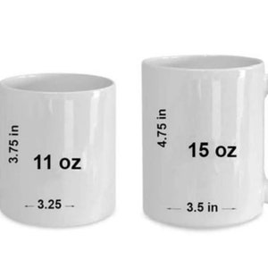 May include: Two white ceramic mugs, one 11 oz and one 15 oz. The mugs are both plain white with black text indicating the size and volume.