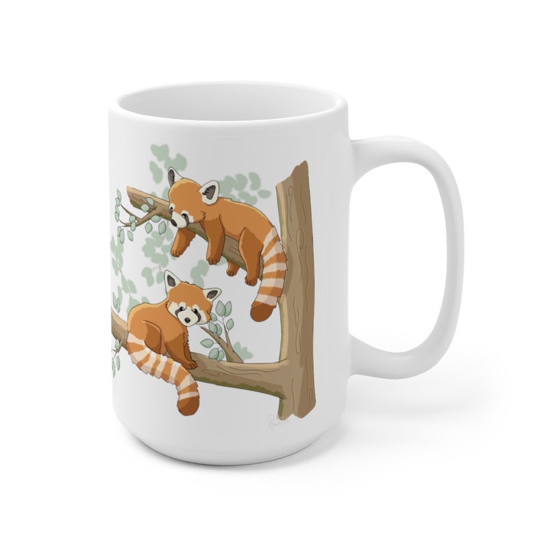 May include: White ceramic mug with a red panda design. Two red pandas are perched on a tree branch with green leaves. The mug has a white handle.