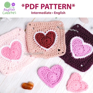 May include: Crocheted heart-shaped squares in pink, burgundy, and peach with white borders and a heart design. The image includes two smaller crocheted hearts and the text "*PDF PATTERN* Intermediate • English".