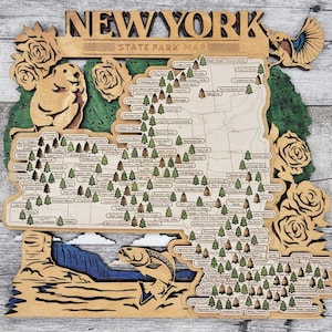 May include: A wooden map of New York State Parks, featuring a beaver, a bird, and a trout. The map is decorated with roses and has the text "NEW YORK STATE PARK MAP" at the top.