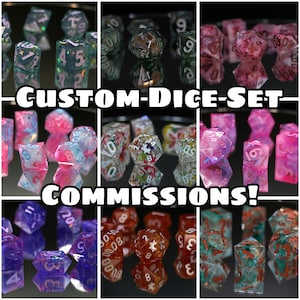 May include: A collage of custom dice sets in various colors and designs. The dice are displayed on a reflective surface, showcasing different styles, including clear, glittery, and patterned options. Text reads "CUSTOM-DICE-SET COMMISSIONS!"