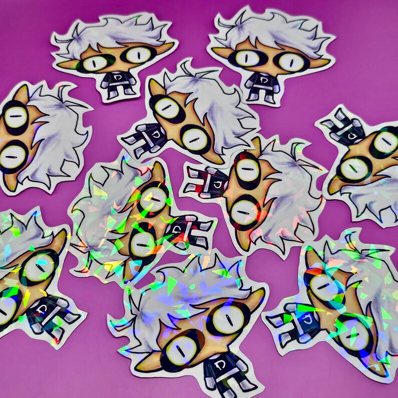 May include: A collection of holographic stickers featuring a cartoon character with white hair, large eyes, and a black uniform. The stickers have a unique, eye-catching design with a shiny, iridescent finish, perfect for decorating laptops, water bottles, or notebooks.