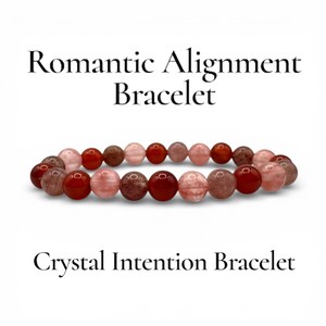 May include: A beaded bracelet with a mix of red, pink, and brown gemstones. The bracelet is labeled "Romantic Alignment Bracelet" and "Crystal Intention Bracelet" in black text against a white background.