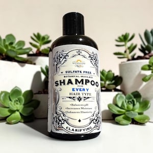 May include: A dark brown plastic bottle of Winslow Botanical Mucilage Shampoo for Every Hair Type. The label features ornate black borders, white background, and text stating Sulfate Free, Balances pH, Increases Moisture, Enhances Elasticity, and Clarifying.