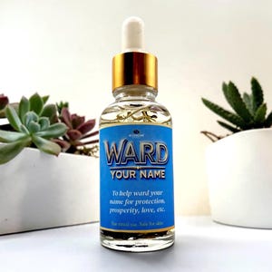 May include: A clear glass dropper bottle with a gold cap and a blue label. The label features the text WARD YOUR NAME and To help ward your name for protection, prosperity, love, etc. For ritual use. Safe for skin.