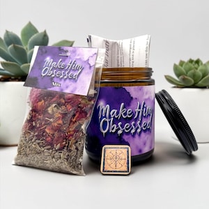 May include: A brown glass jar with a purple label reading Make Him Obsessed, a clear plastic bag containing dried red flower petals and herbs labeled Make Him Obsessed Mix, a small square wooden charm with a circular symbol, and a black lid.