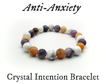 May include: Anti-Anxiety Crystal Intention Bracelet with white, purple, and orange beads.