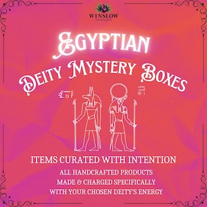 May include: A pink and white graphic with the text "Egyptian Deity Mystery Boxes" in white. The graphic features two white silhouettes of Egyptian deities, Anubis and Bastet, with a white staff in each hand. The text below the silhouettes reads "Items curated with intention, All handcrafted products, Made & charged specifically with your chosen deity's energy."