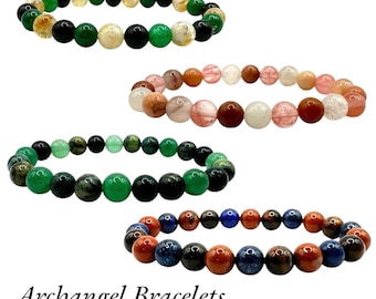 May include: Four beaded bracelets with different colored stones. The bracelets are arranged in a vertical stack, with the top bracelet being green, gold, and black, the second bracelet being pink, red, and white, the third bracelet being green and black, and the bottom bracelet being red, blue, and black. The text "Archangel Bracelets" is at the bottom of the image.