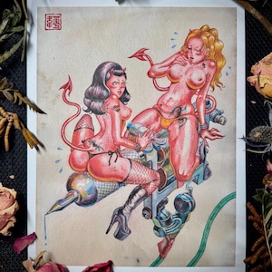May include: A detailed illustration on paper featuring two red-skinned devil figures with tails, one with dark hair and one with blonde hair, riding a large metallic tattoo machine. The artwork includes a red square stamp in the top left corner.