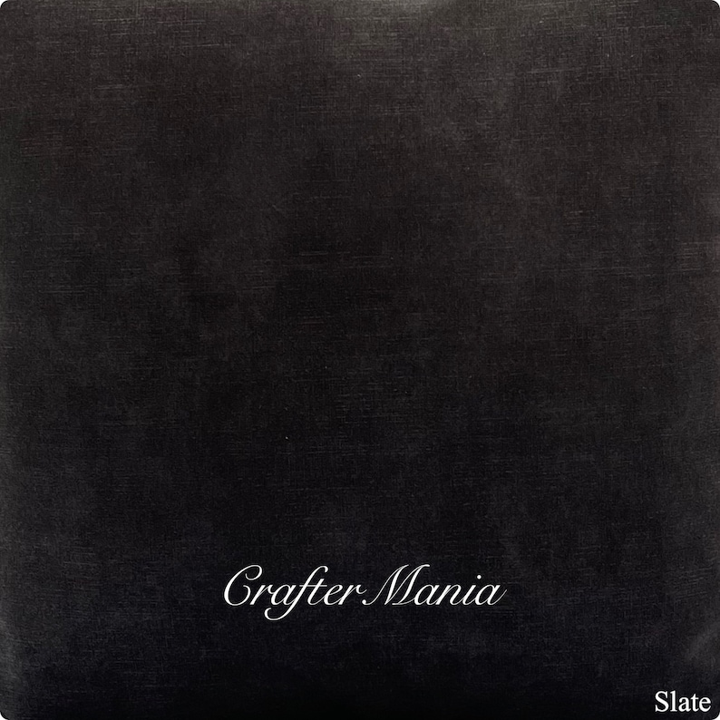 May include: A black textured background with the text "Crafter Mania" in white cursive writing. The text is centered at the bottom of the image. The word "Slate" is in the bottom right corner of the image.