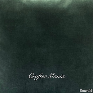May include: A deep emerald green fabric swatch with the text "Crafter Mania" in white cursive lettering and the word "Emerald" in white text at the bottom.
