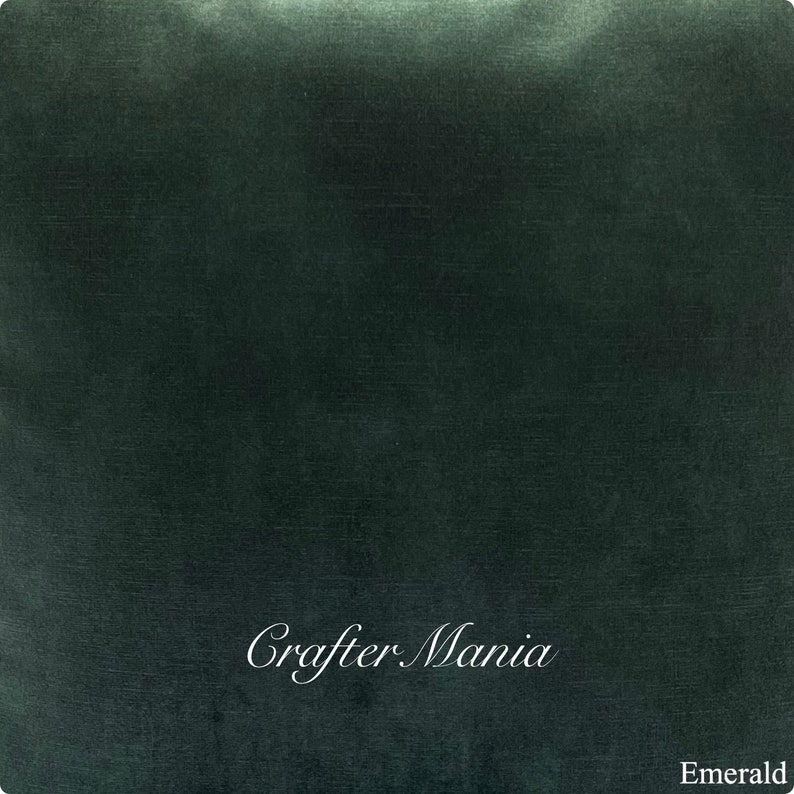 May include: A deep emerald green fabric swatch with the text "Crafter Mania" in white cursive lettering and the word "Emerald" in white text at the bottom.