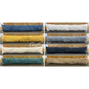 Puede incluir: Un conjunto de diez cojines para puerta en varios colores, incluyendo beige, gris, azul marino, amarillo mostaza, verde oscuro y marrón. Los cojines están hechos de una tela suave y texturizada y miden aproximadamente 38 cm de largo.