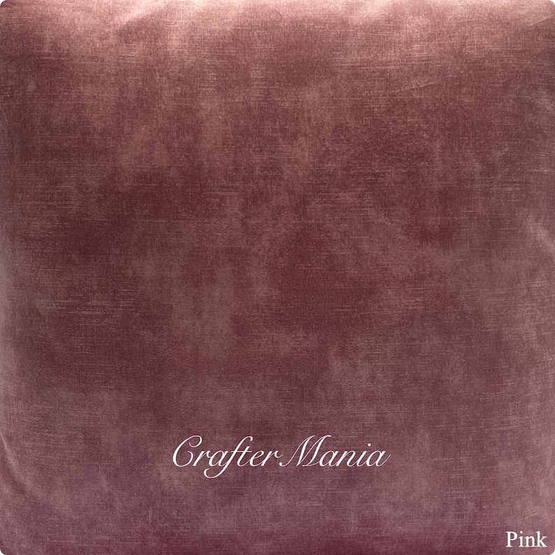 May include: A close-up of a pink velvet fabric with a subtle textured pattern. The fabric has a soft, luxurious feel and is perfect for crafting projects.