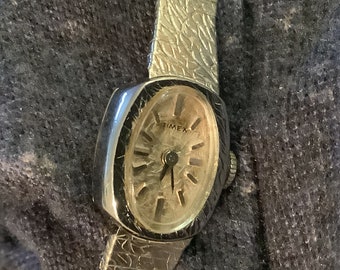 Vintage women’s Timex watch, gold textured dial face. Manual wind up., 1980s