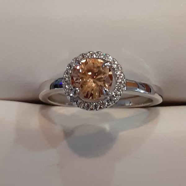 Gorgeous, brilliant morganite ring, approximately 1 carat weight, set with halo of diamond like stones, silver tone band, size US 7