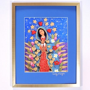 May include: A framed painting of the Virgin Mary in a blue robe with a red dress underneath. She is surrounded by gold hearts and stars on a blue background. The painting is signed "Candy Mayer".