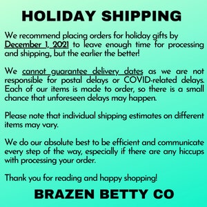 May include: Text on a turquoise background reads "HOLIDAY SHIPPING" and provides holiday shipping recommendations. It states orders should be placed by December 1, 2021. The text also mentions that delivery dates cannot be guaranteed and thanks the reader.