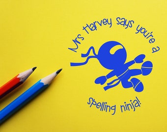 Customised self-inking teacher merit ninja stamp. "you're a spelling ninja". Custom made.