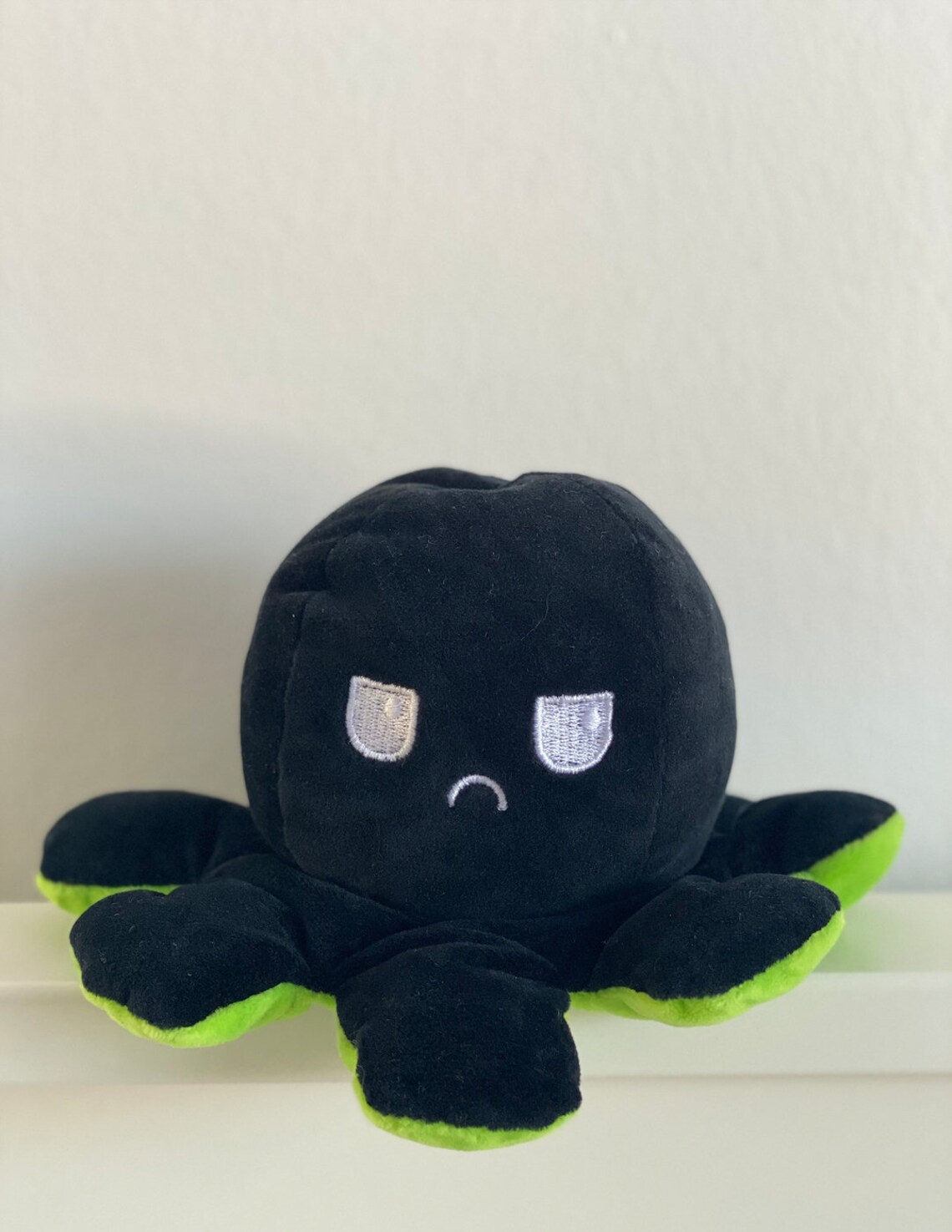 black and green octopus plush