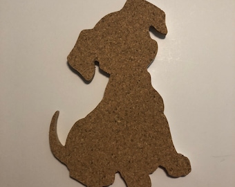 May include: A cork board shaped like a sitting dog. The cork board is brown and has a rough texture.