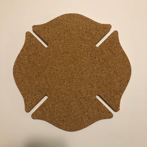 May include: A brown cork fire department badge shaped like a Maltese cross.