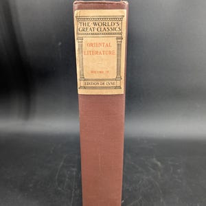 May include: A brown book with a label that reads "The World's Great Classics Oriental Literature Volume IV Edition De Luxe".