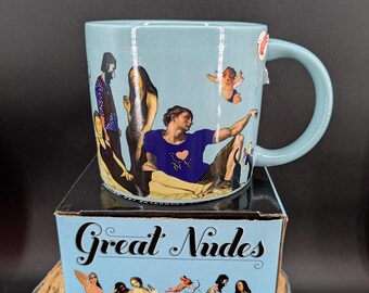 Taza de café con diseño de desnudos artísticos de la Asociación de Filósofos Desempleados, que cambia de color con el calor. Nueva, sin usar, en su caja original de 4 3/8 pulgadas.