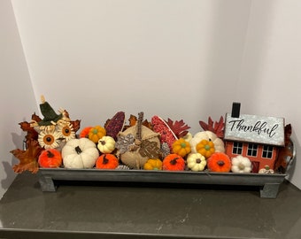 Tin container with pumpkins and fall decor