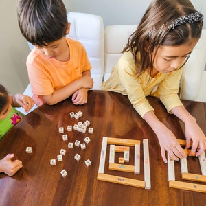 Kids playing with number rods number bonds toy by Little Bud Kids; House of Number Buddies; a Montessori-inspired numerical rods game and math manipulative for building number sense