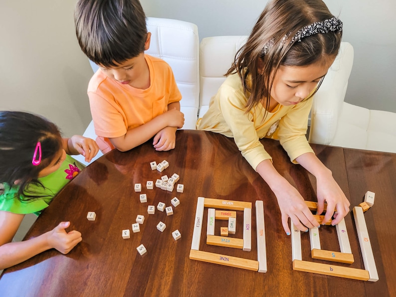 Kids playing with number rods number bonds toy by Little Bud Kids; House of Number Buddies; a Montessori-inspired numerical rods game and math manipulative for building number sense