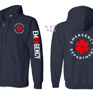 May include: A navy blue zippered hoodie with a white "EMERGENCY" printed on the left sleeve and a red medical symbol with a white heartbeat inside a circle with the text "EMERGENCY DEPARTMENT" on the back.