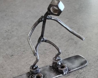 Handmade welded metal snowboarder figurine